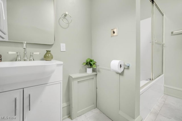 1357 E Blvd Unit 2, Cleveland, OH 44106 - full bath featuring baseboards, toilet, a bath, vanity, and marble finish floor