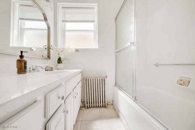 1357 E Blvd Unit 2, Cleveland, OH 44106 - bathroom with radiator, vanity, tile patterned floors, and a healthy amount of sunlight