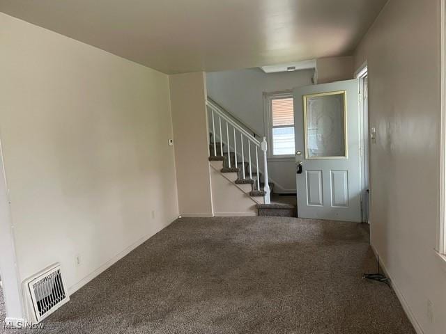 1145 Arnold Ave, Akron, OH 44305 - entryway with stairs, visible vents, carpet, and baseboards