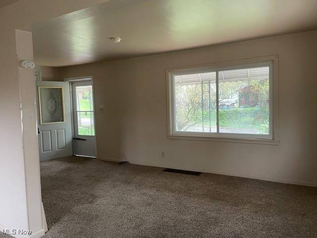 1145 Arnold Ave, Akron, OH 44305 - empty room featuring visible vents and carpet