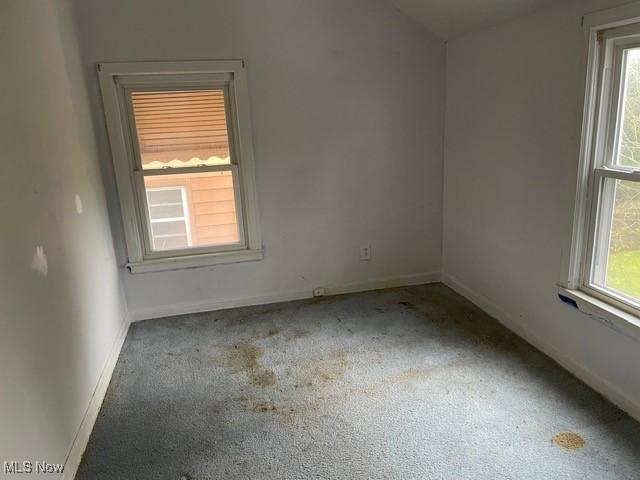 1145 Arnold Ave, Akron, OH 44305 - carpeted empty room with baseboards