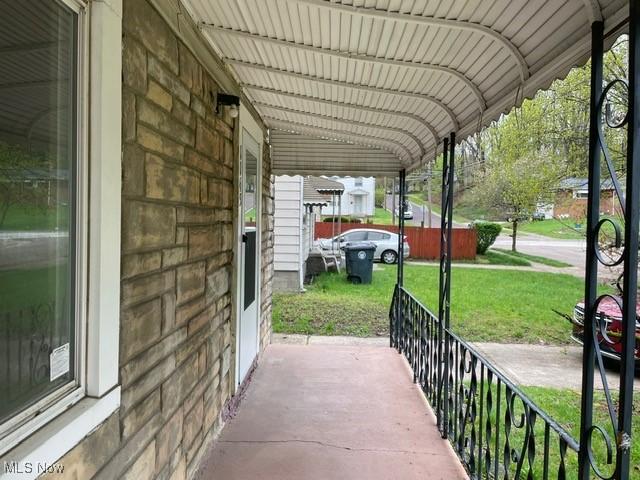 1145 Arnold Ave, Akron, OH 44305 - view of patio featuring covered porch