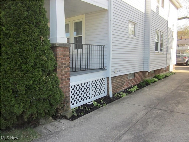 view of side of property with crawl space