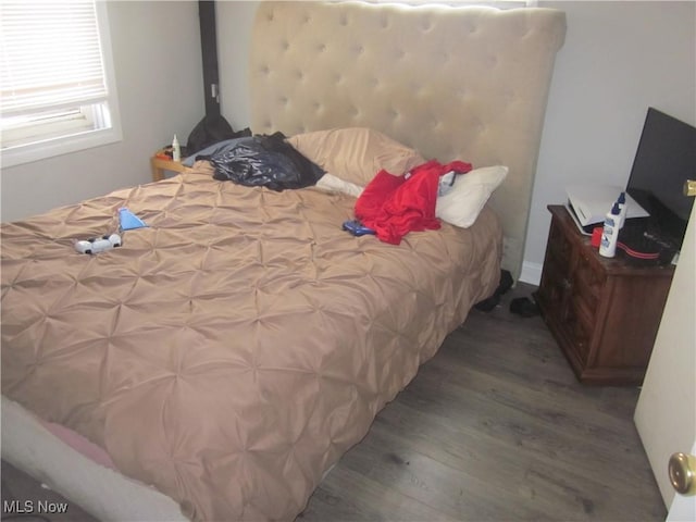 bedroom with wood finished floors