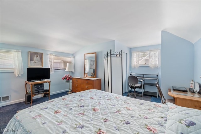 carpeted bedroom with baseboards, visible vents, and vaulted ceiling