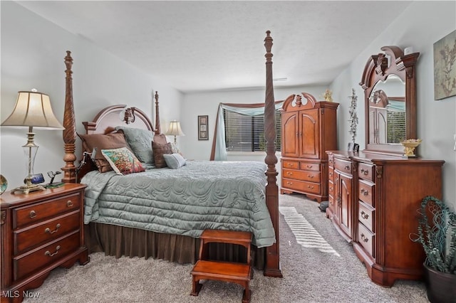 bedroom with light carpet