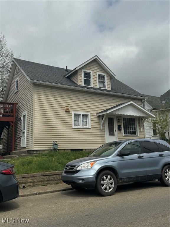 236 S 7th St, Coshocton, OH 43812 - view of side of home with roof with shingles