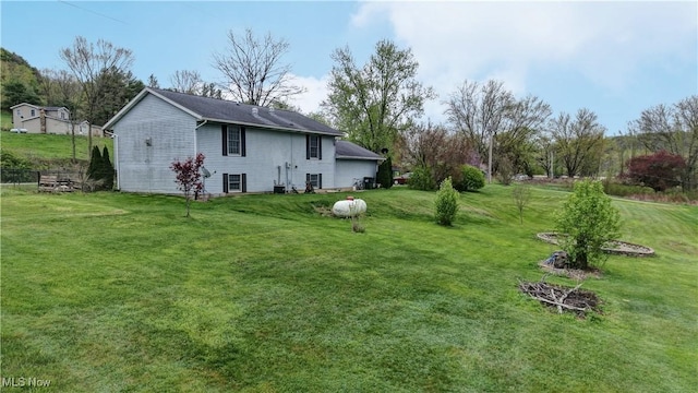 back of house with a yard