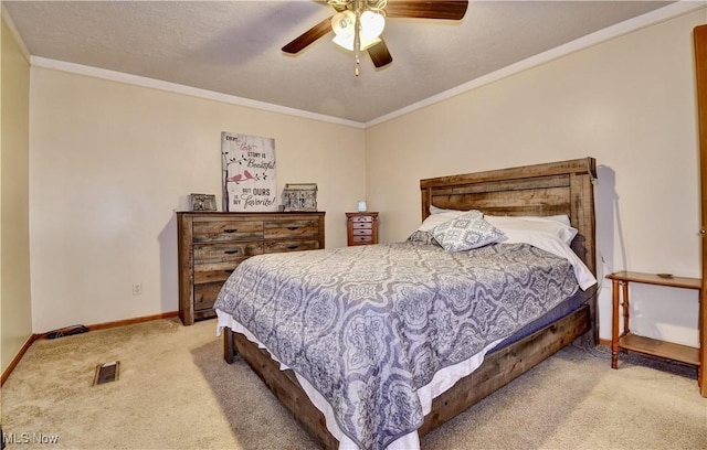 bedroom featuring crown molding, carpet flooring, baseboards, and visible vents