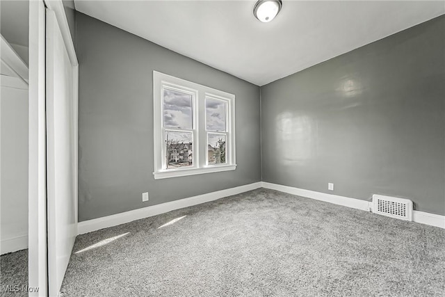 empty room featuring visible vents and baseboards