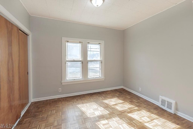 unfurnished bedroom featuring visible vents, baseboards, and a closet