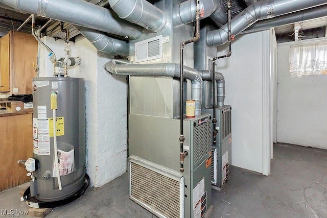 utility room with visible vents and gas water heater