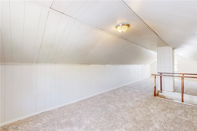bonus room featuring carpet floors and lofted ceiling