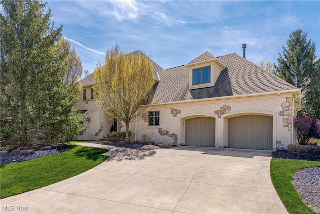 3601 Chapelton Ct, Richfield, OH 44286 - view of front of property with a garage, concrete driveway, stucco siding, and a shingled roof