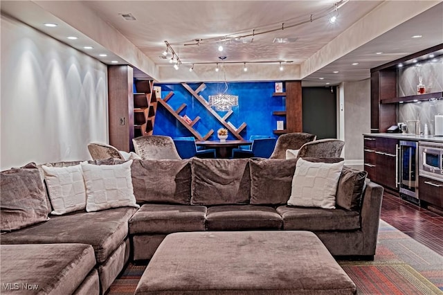 3601 Chapelton Ct, Richfield, OH 44286 - cinema featuring rail lighting, wine cooler, dark wood-type flooring, recessed lighting, and an accent wall