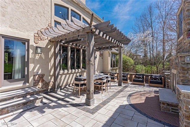 3601 Chapelton Ct, Richfield, OH 44286 - view of patio / terrace with a pergola, an outdoor living space with a fireplace, and outdoor dining space
