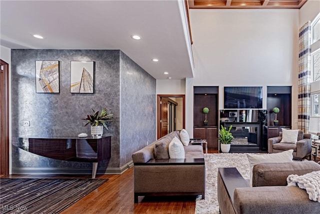 3601 Chapelton Ct, Richfield, OH 44286 - living area featuring a glass covered fireplace, wood finished floors, recessed lighting, and baseboards