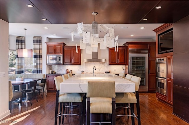 3601 Chapelton Ct, Richfield, OH 44286 - kitchen with appliances with stainless steel finishes, wine cooler, dark wood finished floors, backsplash, and recessed lighting