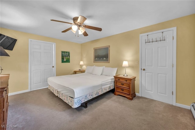 carpeted bedroom with baseboards, a ceiling fan, and a baseboard heating unit