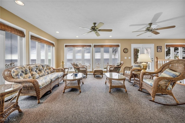 carpeted living room featuring a ceiling fan and recessed lighting