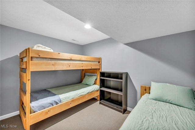 carpeted bedroom featuring baseboards, recessed lighting, a textured ceiling, and visible vents