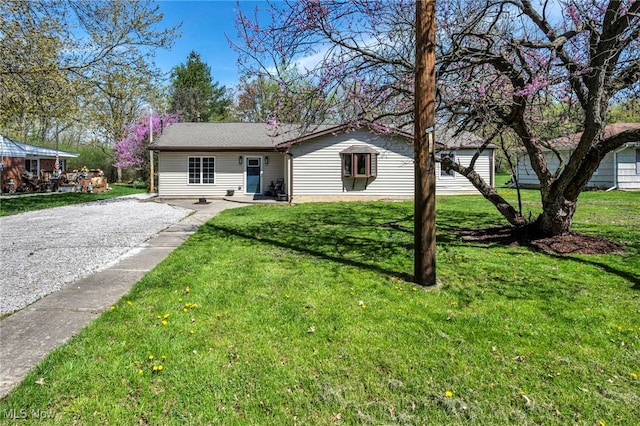 162 E Hamilton St, Oberlin, OH 44074 - view of front of home with gravel driveway and a front yard