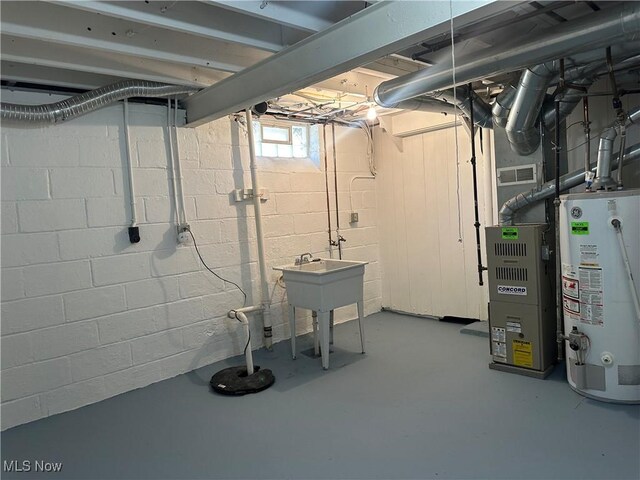 basement with heating unit and gas water heater