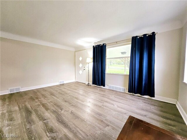 1893 Ridge Rd, Hinckley, OH 44233 - spare room featuring visible vents and wood finished floors