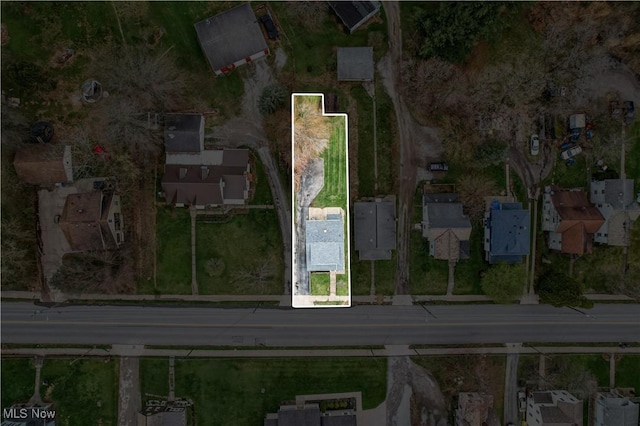 birds eye view of property with a residential view