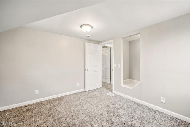 unfurnished bedroom with carpet and baseboards