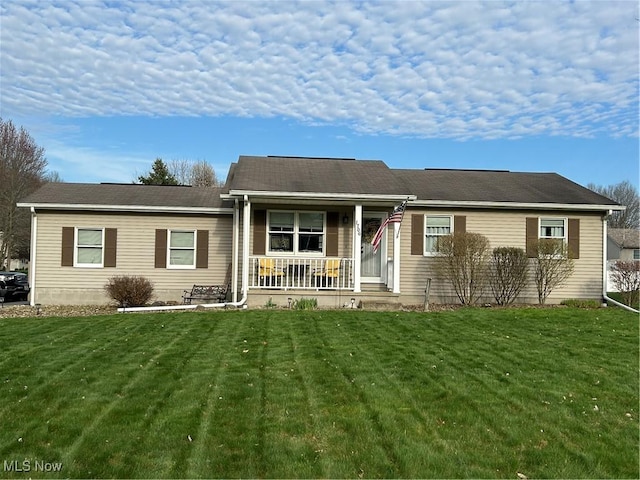 ranch-style house with covered porch and a front lawn