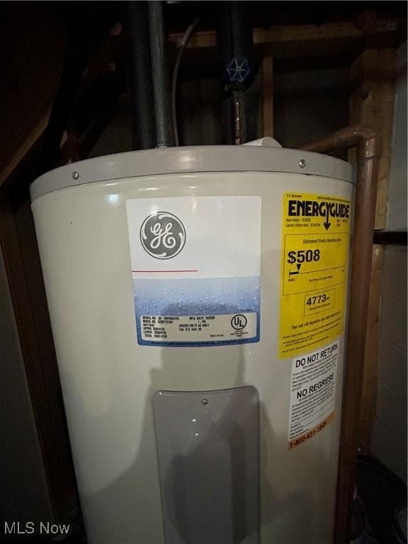 utility room featuring water heater