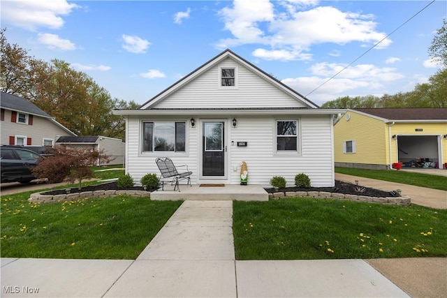 540 Wilbor Ave, Huron, OH 44839 - bungalow-style house featuring a front yard