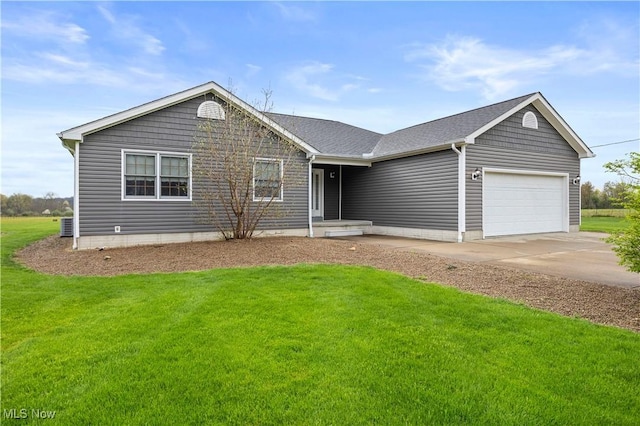 single story home featuring a front yard, driveway, and a garage