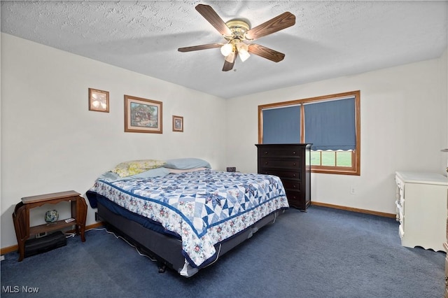 carpeted bedroom featuring baseboards, ceiling fan, and a textured ceiling