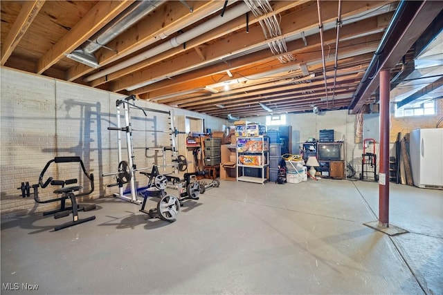below grade area with a healthy amount of sunlight and fridge