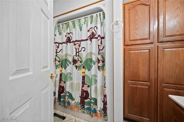 bathroom featuring a shower with curtain