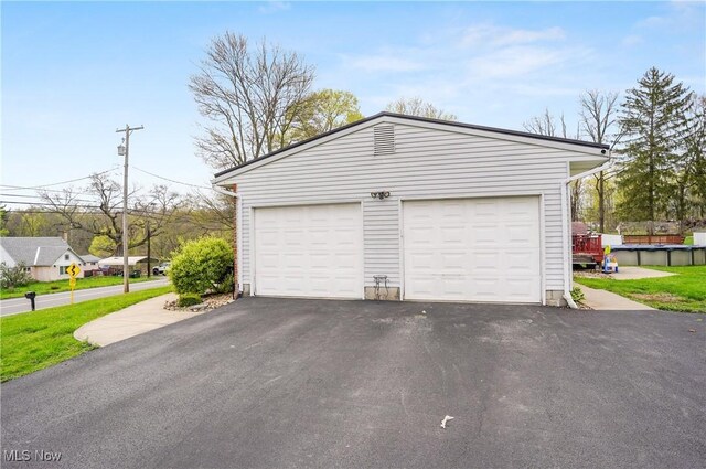 detached garage with aphalt driveway