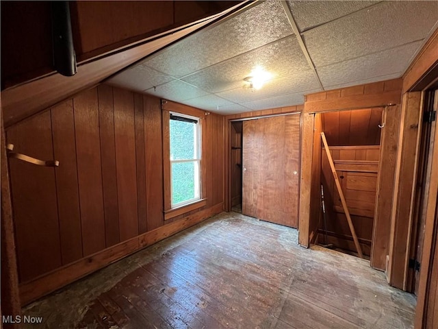 interior space featuring wooden walls