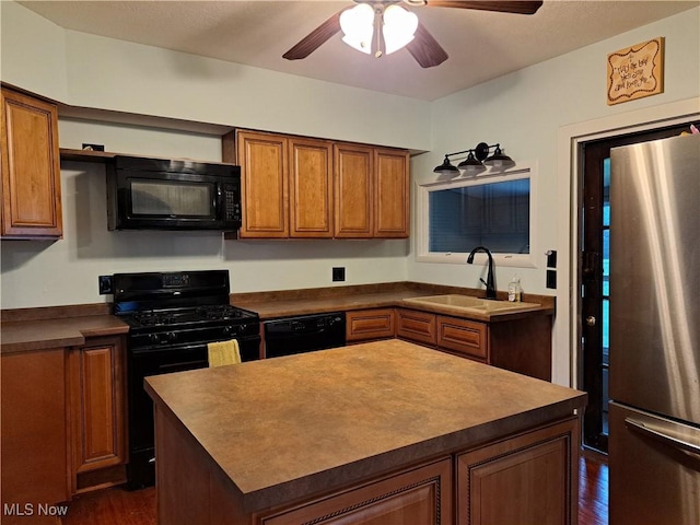 49197 John Tomcho Rd, Cumberland, OH 43732 - kitchen with black appliances, a sink, brown cabinets, dark wood-type flooring, and a ceiling fan