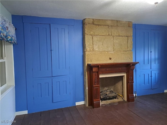 49197 John Tomcho Rd, Cumberland, OH 43732 - unfurnished living room with dark wood-style flooring and a textured ceiling