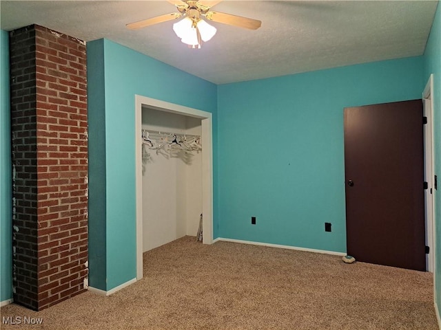 49197 John Tomcho Rd, Cumberland, OH 43732 - unfurnished bedroom featuring carpet flooring, a closet, ceiling fan, and baseboards