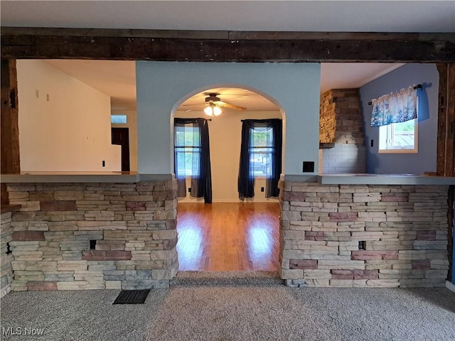 49197 John Tomcho Rd, Cumberland, OH 43732 - kitchen with arched walkways, beamed ceiling, wood finished floors, and ceiling fan