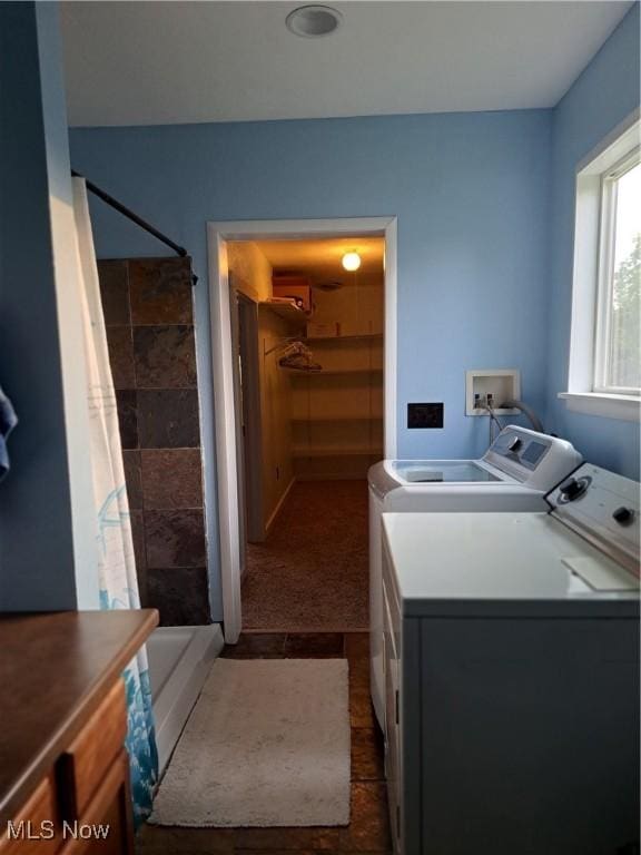 49197 John Tomcho Rd, Cumberland, OH 43732 - clothes washing area with separate washer and dryer, dark colored carpet, and cabinet space