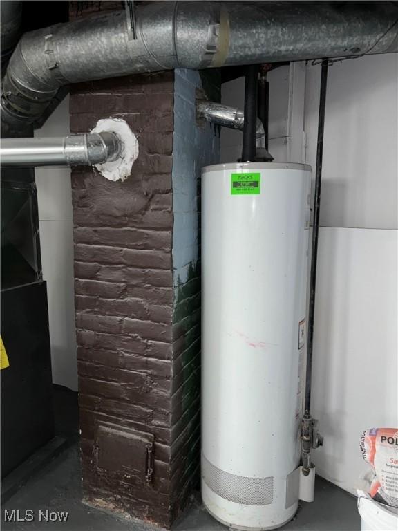 4399 W 57th St, Cleveland, OH 44144 - utility room featuring water heater