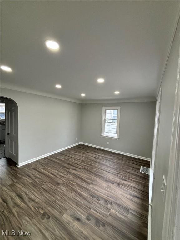4399 W 57th St, Cleveland, OH 44144 - below grade area featuring dark wood-style flooring, visible vents, baseboards, ornamental molding, and recessed lighting