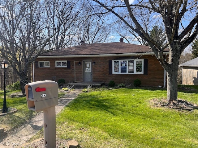 single story home featuring a front lawn and brick siding