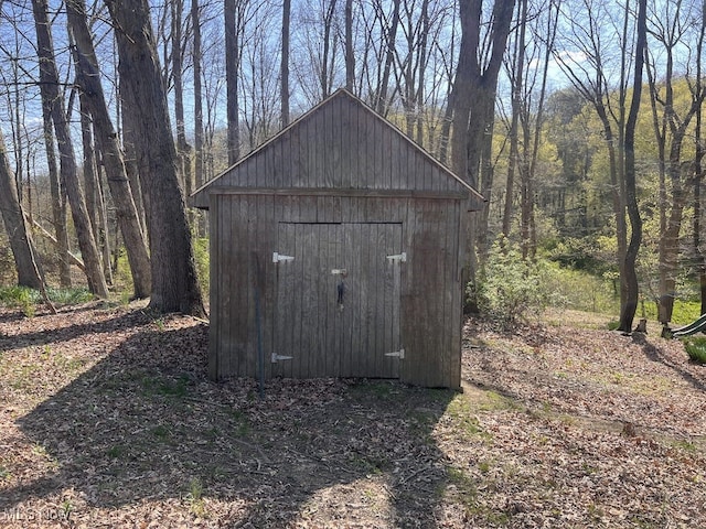 view of shed featuring a forest view