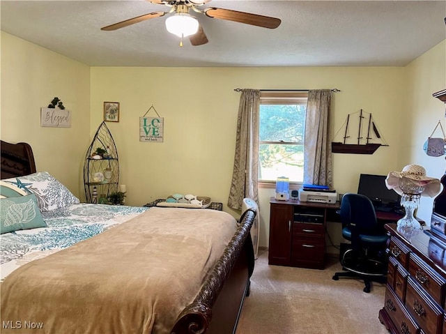 bedroom with ceiling fan and light colored carpet