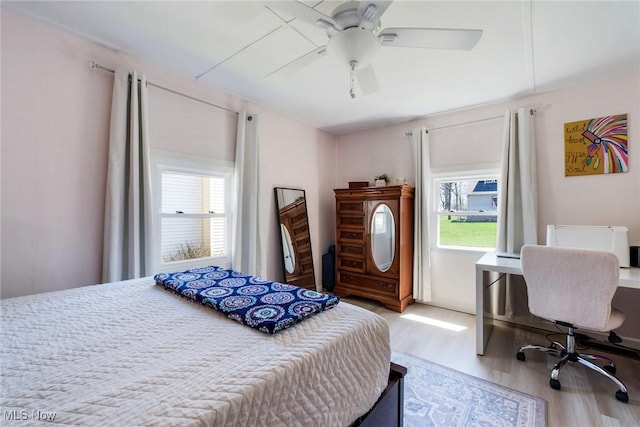 bedroom featuring wood finished floors and a ceiling fan